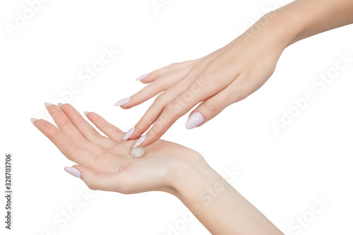 female hands to hold a small stone it is isolated on a white background