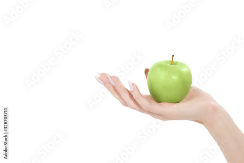 the female hand holds green apple healthy food fruit vitamins is isolated on a white background