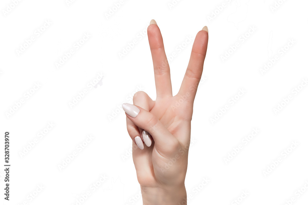 the female hand shows gesture a victory is isolated on a white background the female hand shows gesture a victory is isolated on a white background