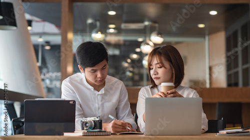Young business teamwork working with business report document on office desk.Brainstorming Business People Design Planning,Brainstorming Planning Partnership.  © Songsak C
