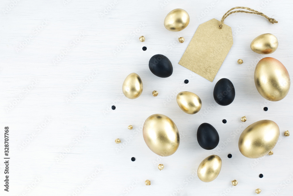 Minimal gold eggs easter concept. Stylish easter golden and black eggs with golden label for sales, promotion. Flat lay trendy easter. Happy easter card with copy space for text