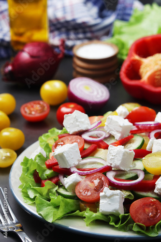 A plate full of bright fresh vegetable salad 