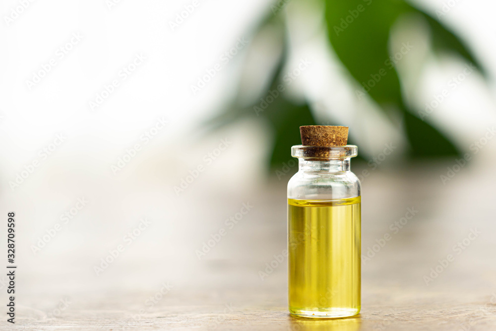 Bottle of cbd hemp essential oil made of marijuana on white background. Medical, relaxing weed concept.