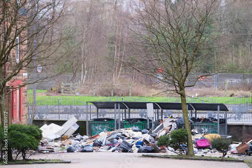 Fly tipping rubbish left in derelict housing development causing pollution