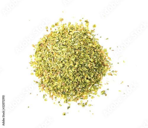 Pile of dried oregano leaves isolated on white background. top view