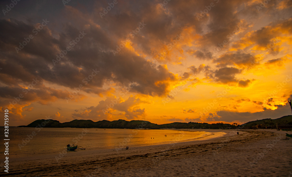 colorful sunset with many clouds at the Tanjung Aan beach in Lombok Indonesia