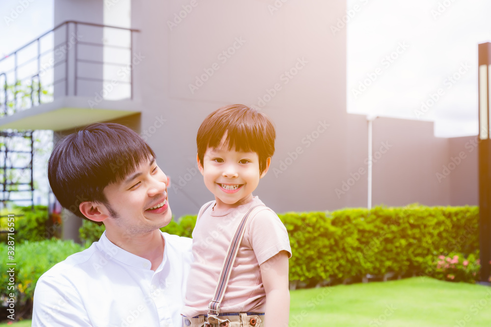 Happy children. Adorable little asian child feel happiness, smiley face when father come to visit lovely young boy. Dad and son walking together. They enjoy life, love each other. Dad carry kid. Happy children. Adorable little asian child feel happiness, smiley face when father come to visit lovely young boy. Dad and son walking together. They enjoy life, love each other. Dad carry kid.