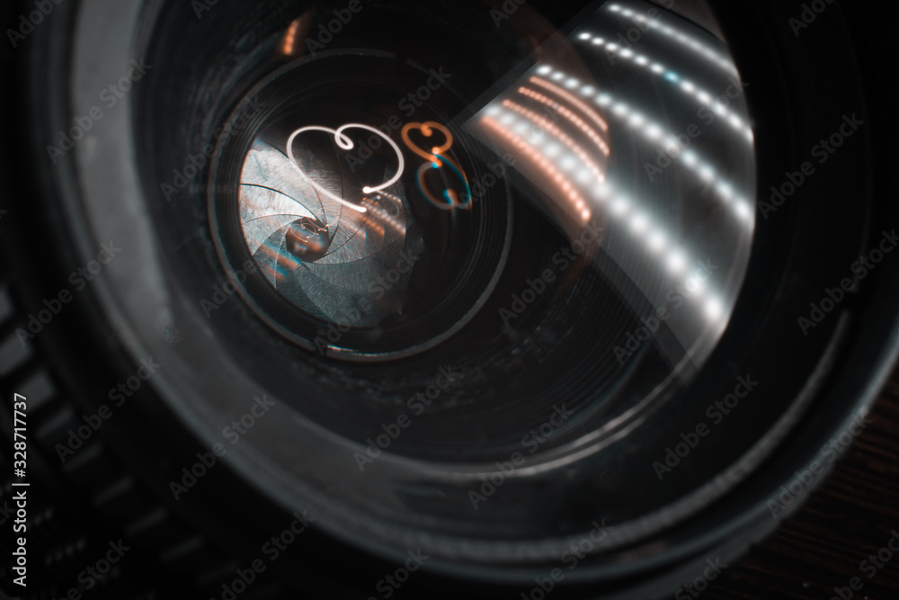 Drawing a heart with light in the lens glass Drawing a heart with light in the lens glass