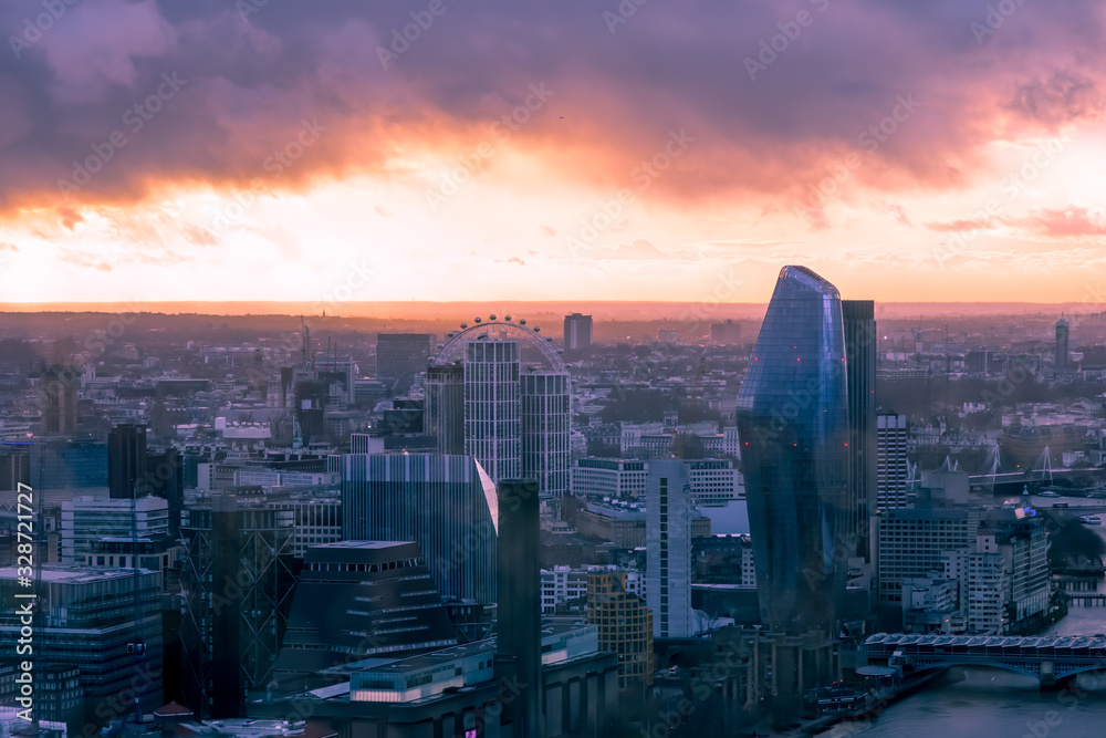 Hazy, menacing sky above London cityscape at sunset with a dystopian feel