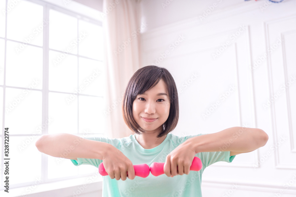 Beautiful Asian girl, Fit sportswoman exercising and training at home Beautiful Asian girl, Fit sportswoman exercising and training at home