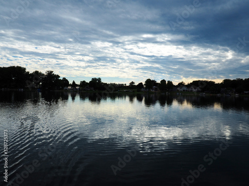 Lake with blue skies and clouds reflected