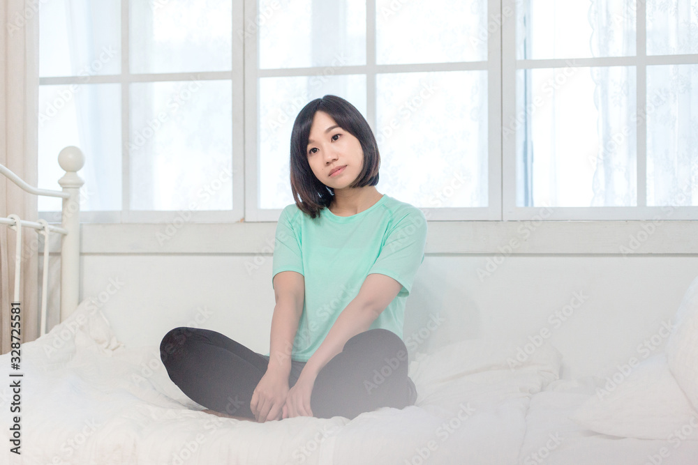 Portrait of calm Asian girl meditation in the morning. Young woman indoors Living lifestyle at home. Portrait of calm Asian girl meditation in the morning. Young woman indoors Living lifestyle at home.