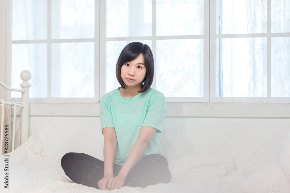 Portrait of calm Asian girl meditation in the morning. Young woman indoors Living lifestyle at home. Portrait of calm Asian girl meditation in the morning. Young woman indoors Living lifestyle at home.