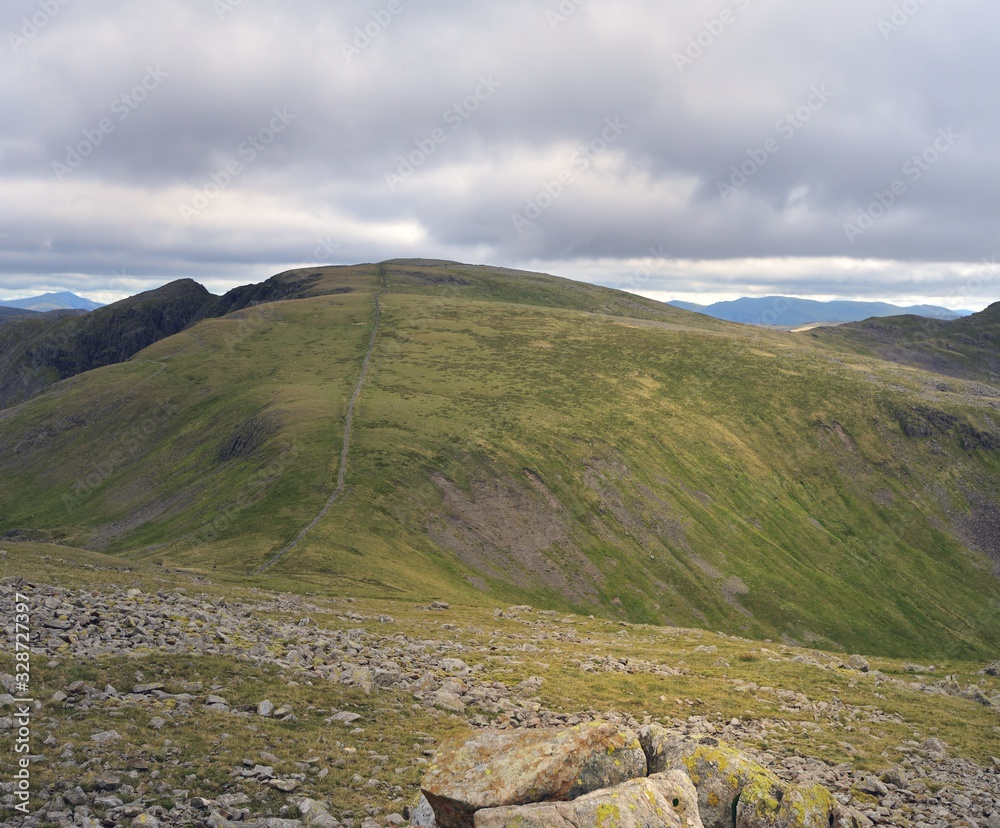 Fototapeta premium The long dry stone wall upto Scoat fell