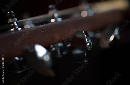 closeup of a guitar, guitar string tensioners, macro photo