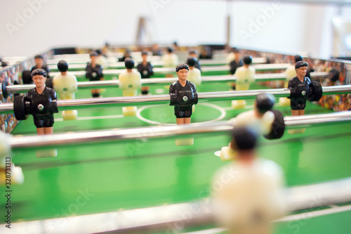 Big game table football in a bright room. Figures of soccer players close-up © borisenkoket