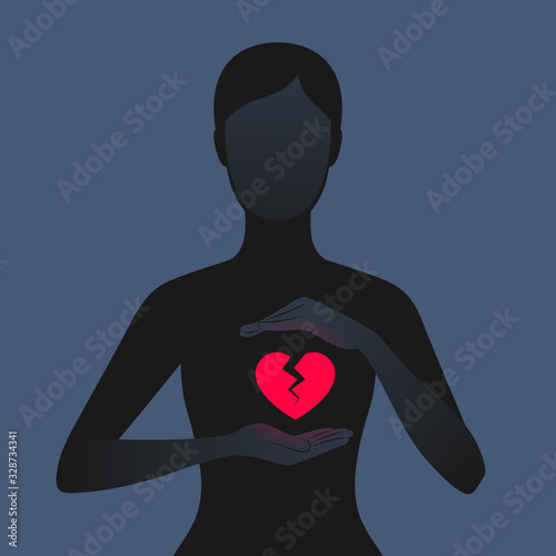 Dark silhouette of woman holding hands near her red broken heart