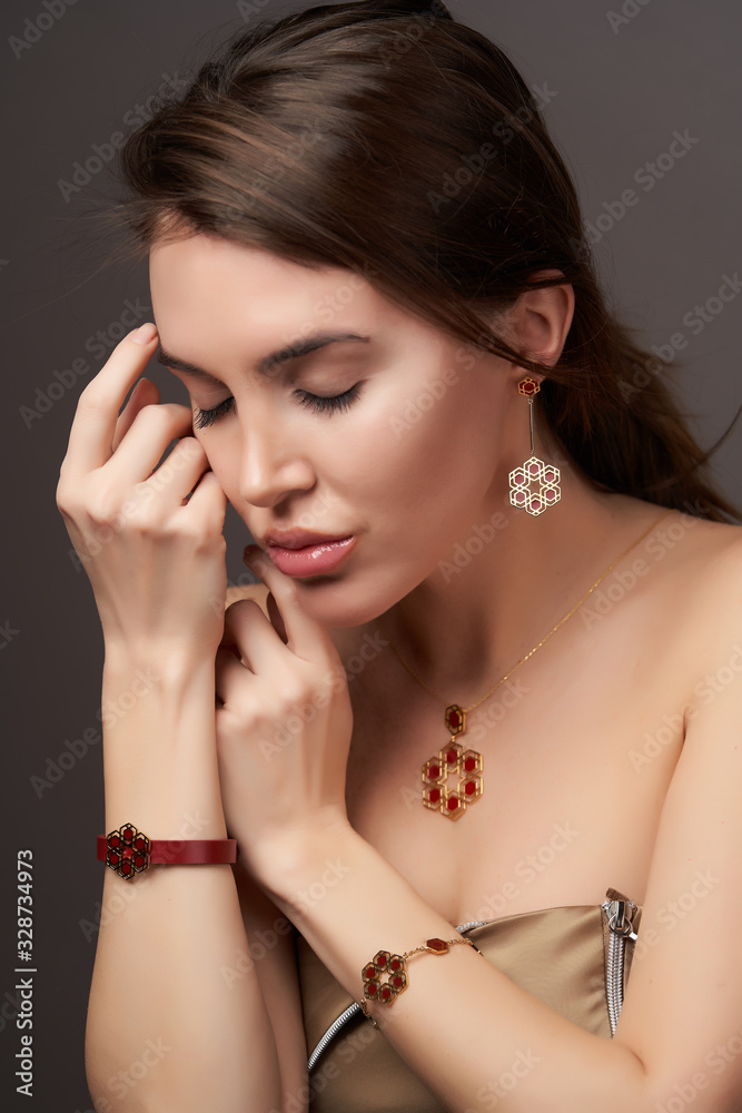 Beautiful woman portrait on gray background, close-up Beautiful woman portrait on gray background, close-up