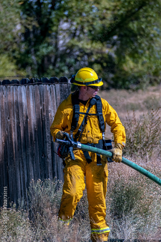 Firefighter Pulling Hose Firefighter Pulling Hose