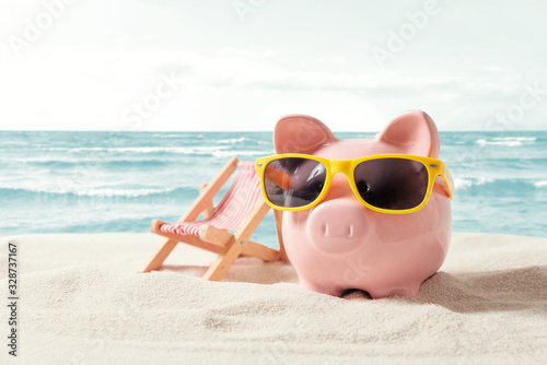 Piggy bank on vacation. Finance and travel concept
