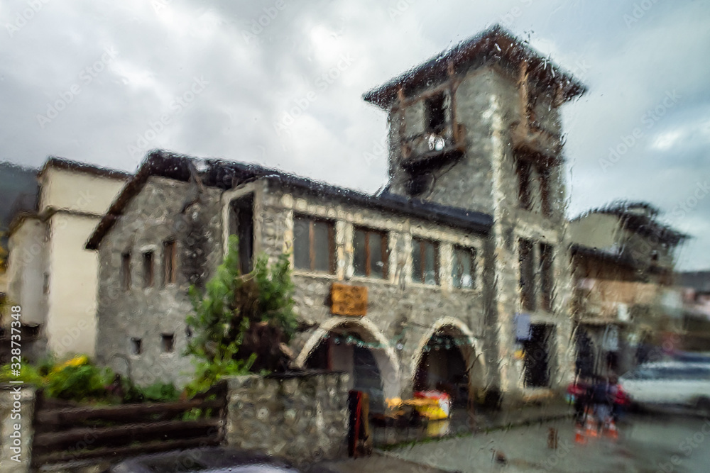 The view from the window in rainy weather on a buildings in a village in Svaneti in the mountainous part of Georgia The view from the window in rainy weather on a buildings in a village in Svaneti in the mountainous part of Georgia