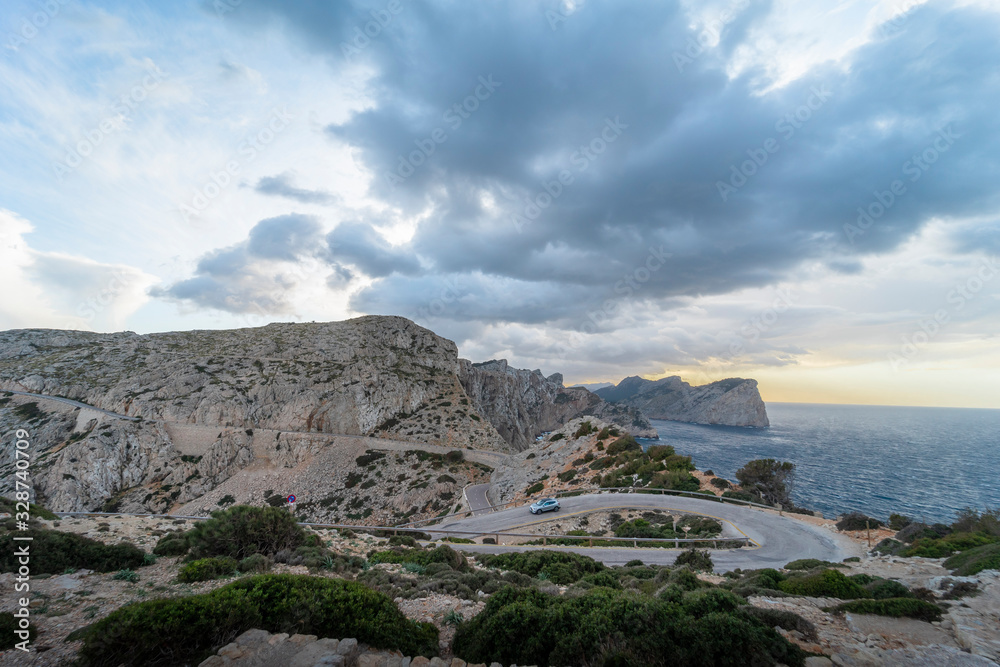 Cloudy landscape of the winding road towards the lighthouse of Cabo de Formentor, on the coast of Pollensa, Mallorca