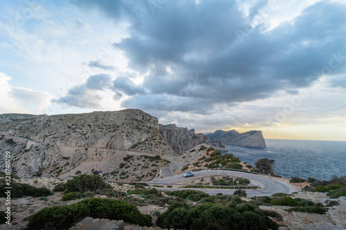 Cloudy landscape of the winding road towards the lighthouse of Cabo de Formentor, on the coast of Pollensa, Mallorca