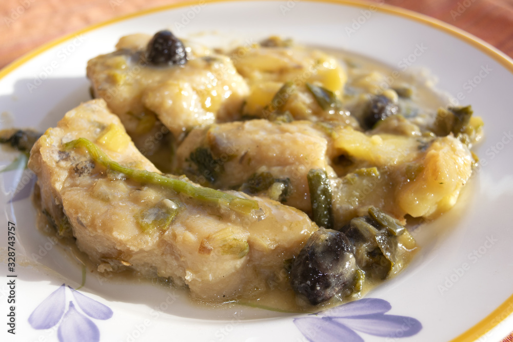 stewed cod with onion and olives