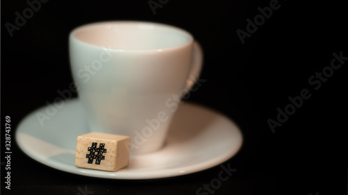 Colombian coffee cup on beans and dark background