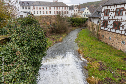 Historic buildings and Erft river in Bad Muenstereifel photo