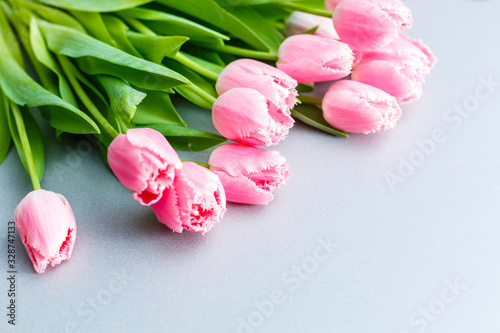 A bouquet of pink tulips on the table for International Women's Day