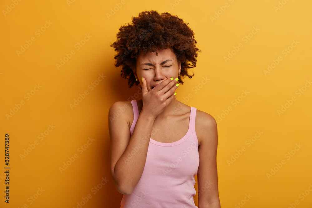 Depressed woman experiences painful moment, cries as finds out tragic news, covers mouth with palm, has sad expression, needs support in difficult life situation. People, negative emotions, feelings Depressed woman experiences painful moment, cries as finds out tragic news, covers mouth with palm, has sad expression, needs support in difficult life situation. People, negative emotions, feelings