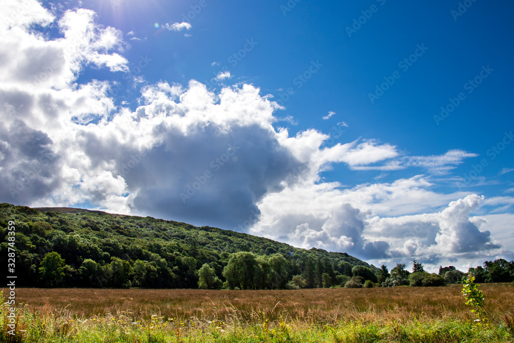 Blue Sky and Clouds Over a Scottish Mountain