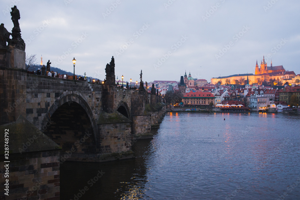 Evening walk sightseeing traveling fall to Prague, Czech Republic. Charles bridge and promenade.