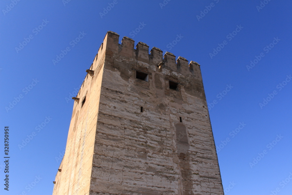 Watch and arms towers of Alcazaba fortress at the historical Alhambra Palace complex in Granada, Andalusia, Spain. Watch and arms towers of Alcazaba fortress at the historical Alhambra Palace complex in Granada, Andalusia, Spain.