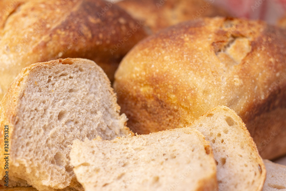 Bakery - golden rustic bread crusts. Fresh aromatic bread on the table. Food concept.