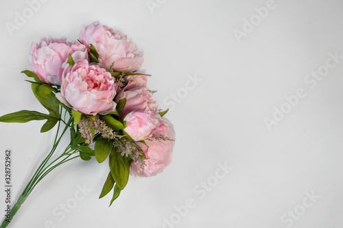 bouquet of pink peonies on white background copy space. © olga_demina