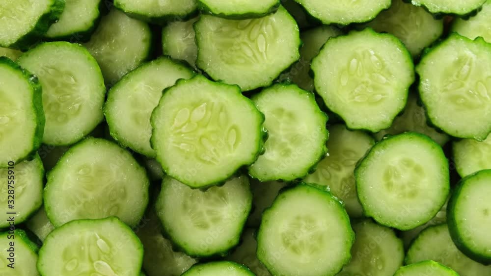 Top view of fresh sliced cucumber rotation. Close up. Top view of fresh sliced cucumber rotation. Close up.