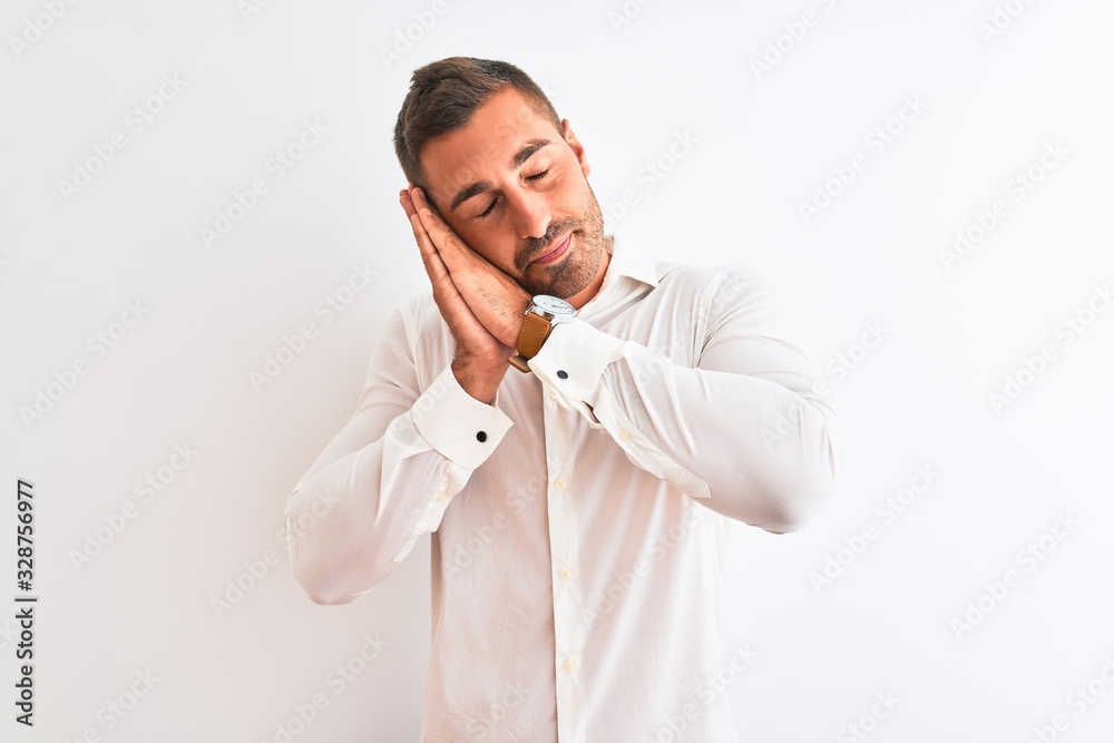 Young handsome business man wearing elegant shirt over isolated background sleeping tired dreaming and posing with hands together while smiling with closed eyes. Young handsome business man wearing elegant shirt over isolated background sleeping tired dreaming and posing with hands together while smiling with closed eyes.