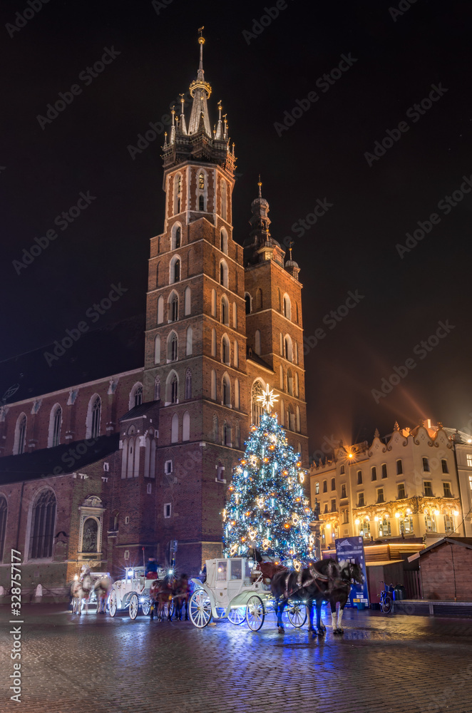 Krakow, Poland, Christmas tree on Main Square and St Mary's church