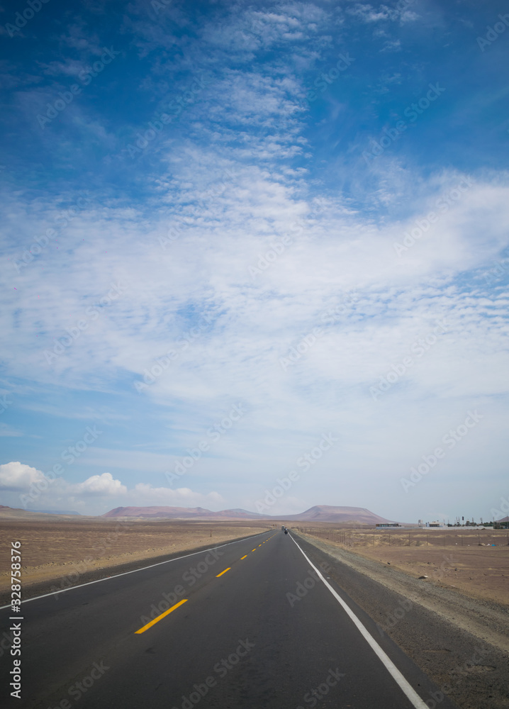 a lonely day road in the middle of the desert a lonely day road in the middle of the desert