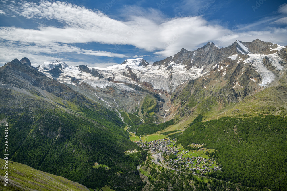 View on Saas-Fee village with beautiful Alps and Fee glacier in background in Switzerland