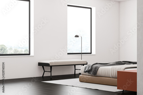 White master bedroom interior with bench