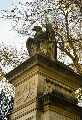 PRINCETON, NJ USA - NOVENBER 12, 2019: Stone column with eagle sculptures and wrought iron gate at the entrance to Princeton University. NJ USA photo