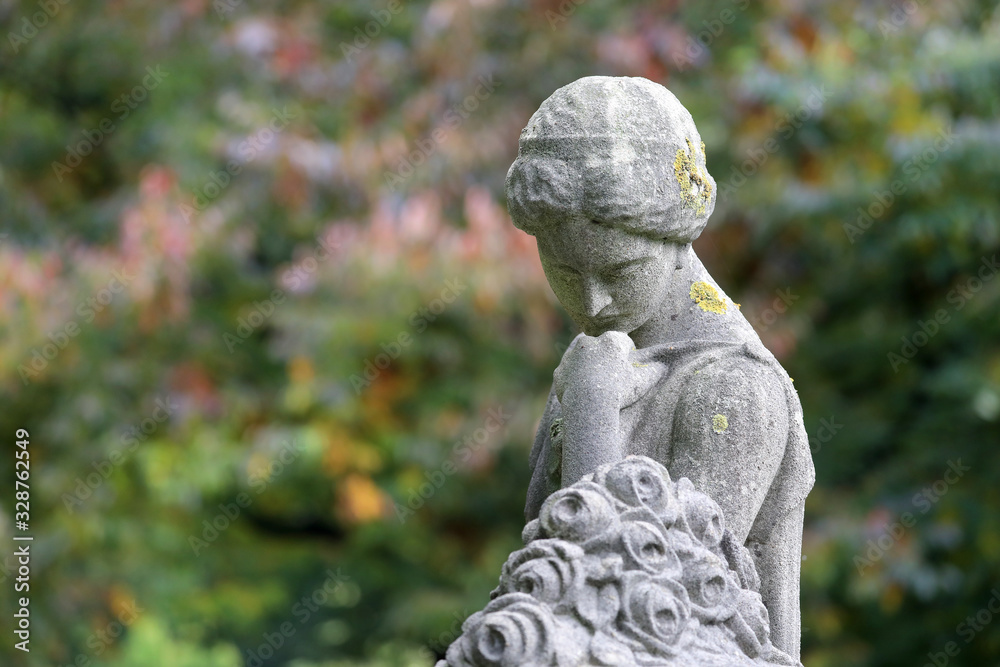statue of sorrow at municipal cemetery in Amsterdam at springtime, The Netherlands statue of sorrow at municipal cemetery in Amsterdam at springtime, The Netherlands