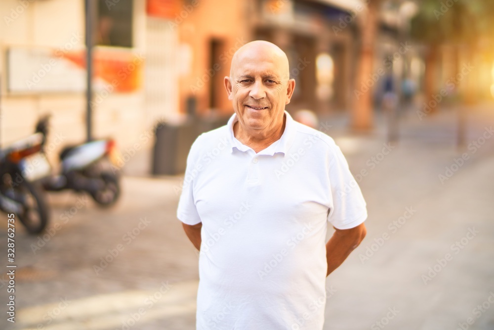 Senior handsome man smiling happy and confident. Standing with smile on face at town street Senior handsome man smiling happy and confident. Standing with smile on face at town street