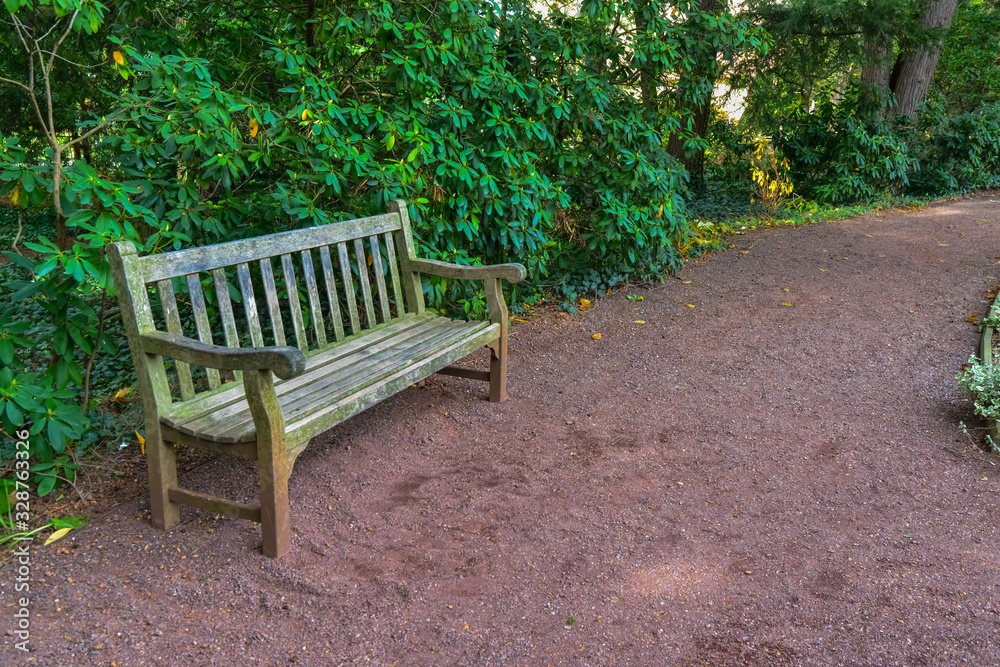 PRINCETON, NJ USA - NOVENBER 12, 2019: Princeton University park wooden bench, garden design PRINCETON, NJ USA - NOVENBER 12, 2019: Princeton University park wooden bench, garden design