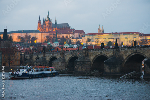 Evening walk sightseeing traveling fall to Prague, Czech Republic. Charles bridge and promenade.