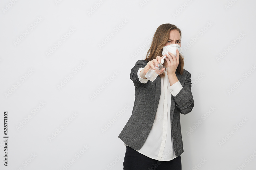 Businesswoman using rubbing alcohol to avoid Corona virus covid-19 looking afraid of illness