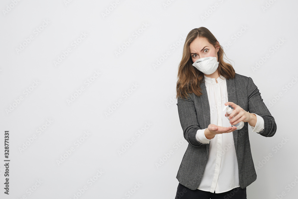 Businesswoman using rubbing alcohol to avoid Corona virus covid-19 or covid looking afraid of being sick and of having the disease Businesswoman using rubbing alcohol to avoid Corona virus covid-19 or covid looking afraid of being sick and of having the disease